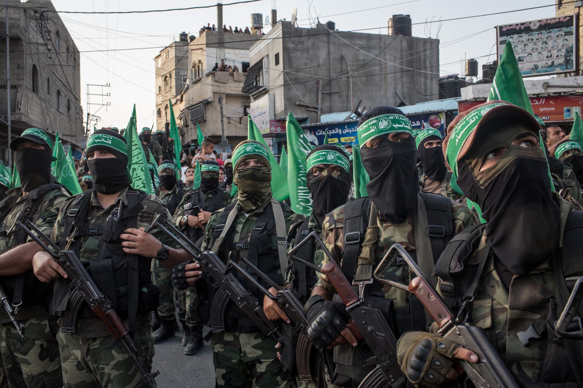 Chris McGrath/Getty Images Hamas militants are seen during a military show in the Bani Suheila district in Gaza City, Gaza.