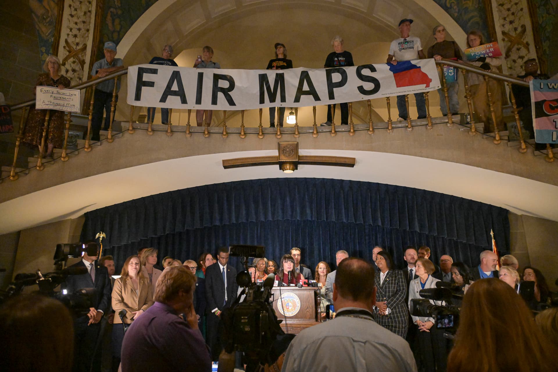Michael Thomas/Getty Images
Activists display signs inside the rotunda of the State Capitol Building at Jefferson City, Missouri, on September 10, 2025.