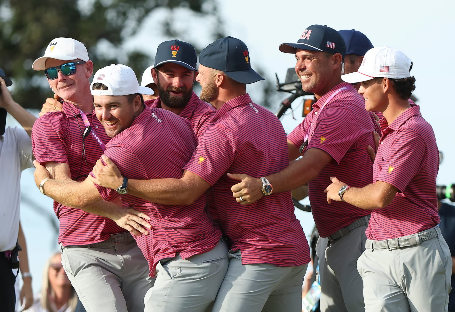 Sarah Stier/Getty Images Members of the U.S. Team celebrate after the U.S. Team wins 17-13 on the 18th green during Sunday's Singles on day four of the Presidents Cup 2026 at Medinah Country Club on September 27, 2026 at Medinah, Illinois.