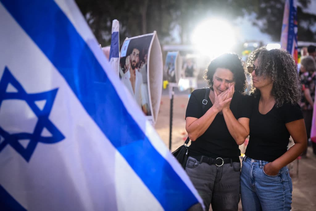 Leon Neal/Getty Images Family members and friends of the lost and kidnapped gather at the site of the Nova Festival to mark the one year anniversary of the attacks by Hamas, on October 07, 2024 at Re'im, Israel.