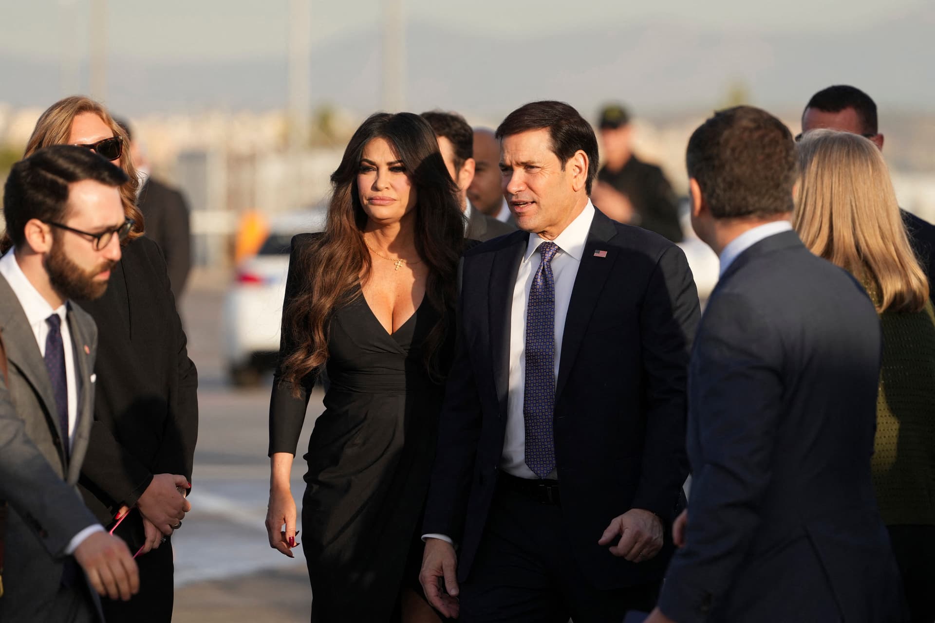 Photo by Mark Schiefelbein / POOL / AFP via Getty Images. U.S. Secretary of State Marco Rubio, flanked by U.S. Ambassador to Greece Kimberly Guilfoyle, at Eleftherios Venizelos International Airport near Athens.