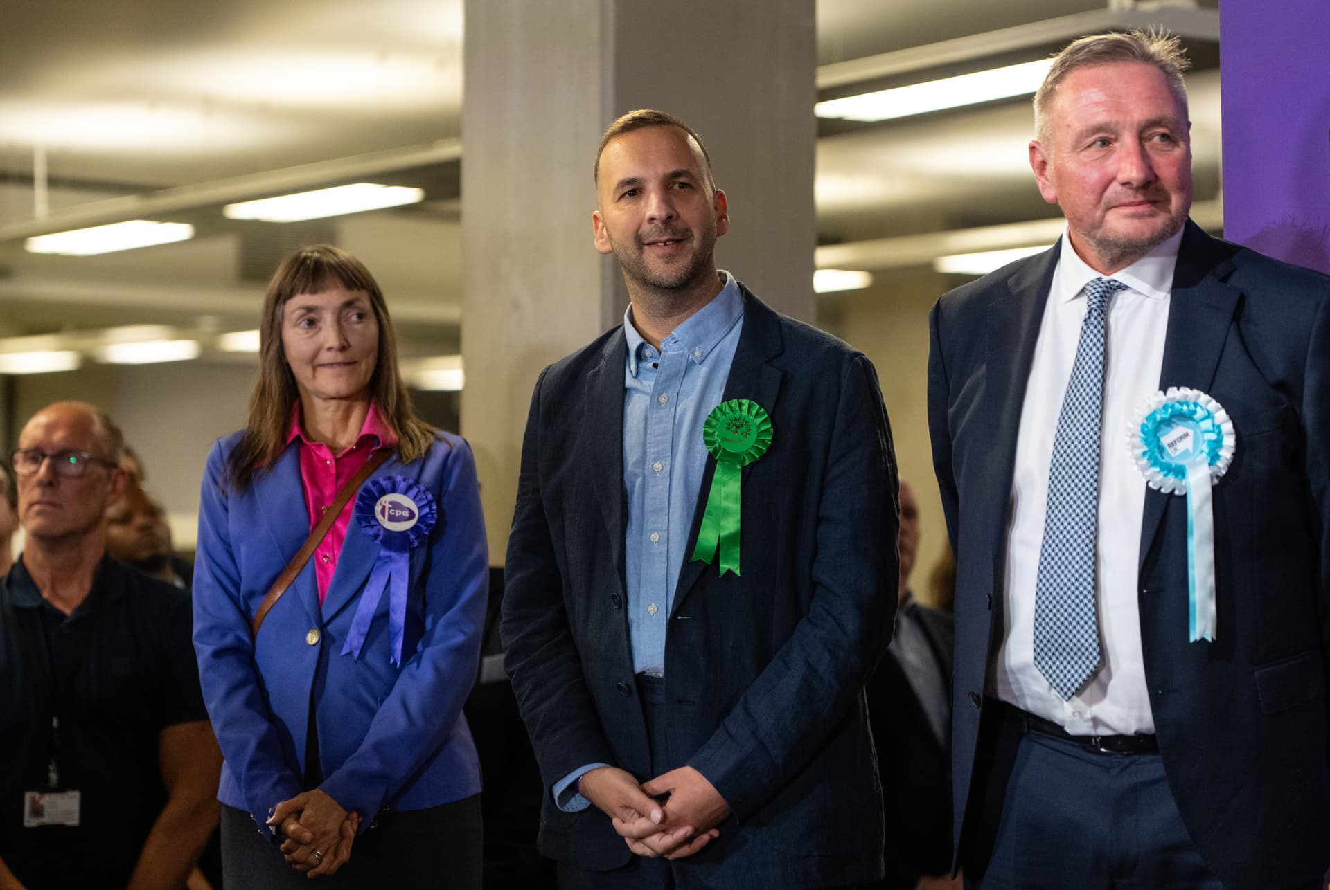 Carl Court/Getty Images. Green Party leader, Zack Polanski (C), attends the count declaration in the Holborn and St Pancras by-election.