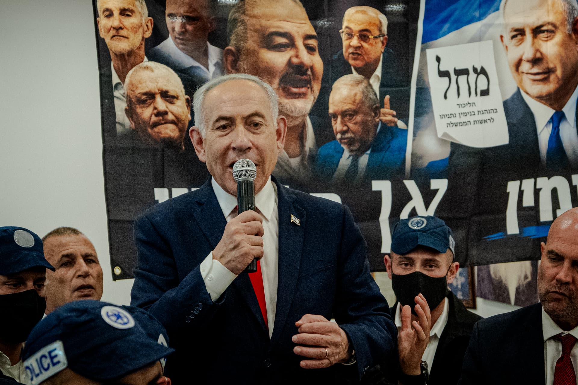 Erik Marmor/Getty Images. Israeli Prime Minister Benjamin Netanyahu speaks to local residents and supporters during a campaign stop at HaTikva Market.