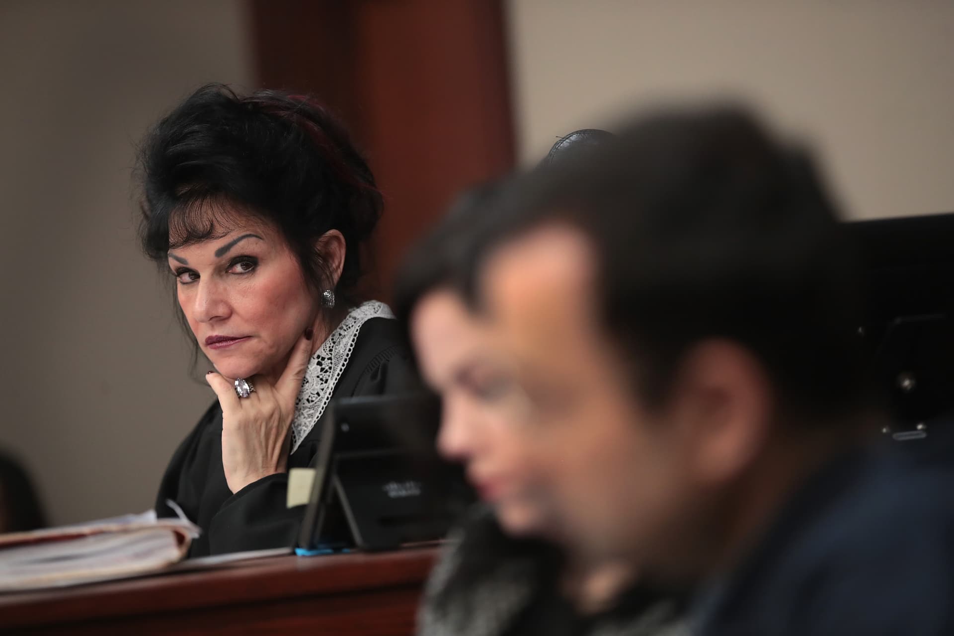 Scott Olson/Getty Images FILE: Judge Rosemarie Aquilina looks at Larry Nassar as he listens to a victim's impact statement by Jennifer Rood Bedford prior to being sentenced after being accused of molesting about 100 girls while he was a physician for USA Gymnastics and Michigan State University, where he had his sports-medicine practice on January 16, 2018, at Lansing, Michigan.