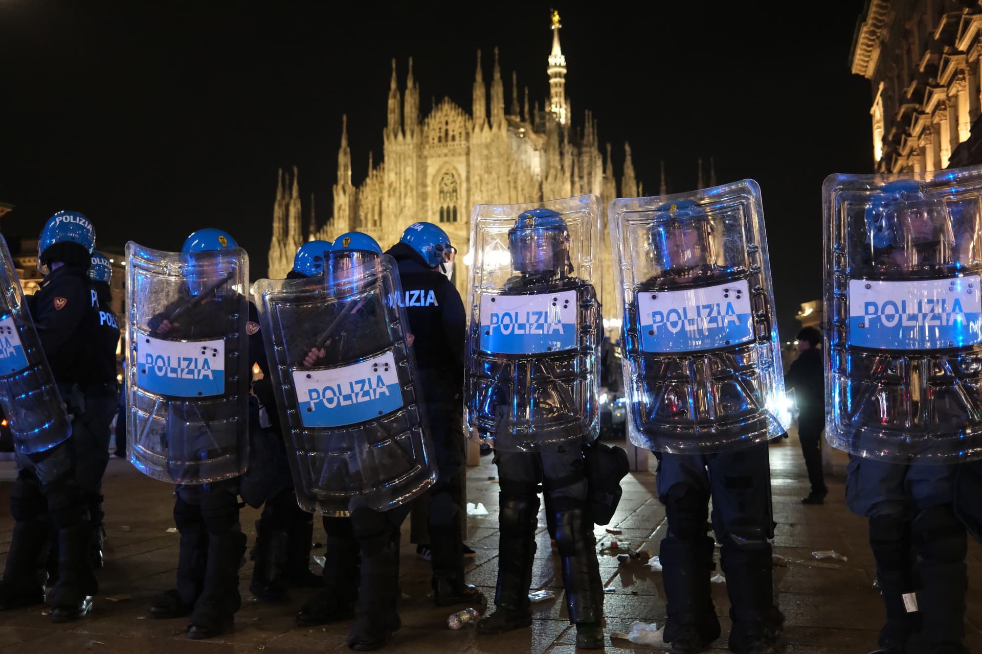 Adam Berry/Getty Images Police stand guard outside the Milan's cathedral after protests turned violent on October 17, 2026.